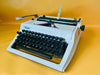 Erika Mod. 100 Typewriter | Spanish QWERTY Portable Manual Typewriter | Black Leather Case | Made in GDR