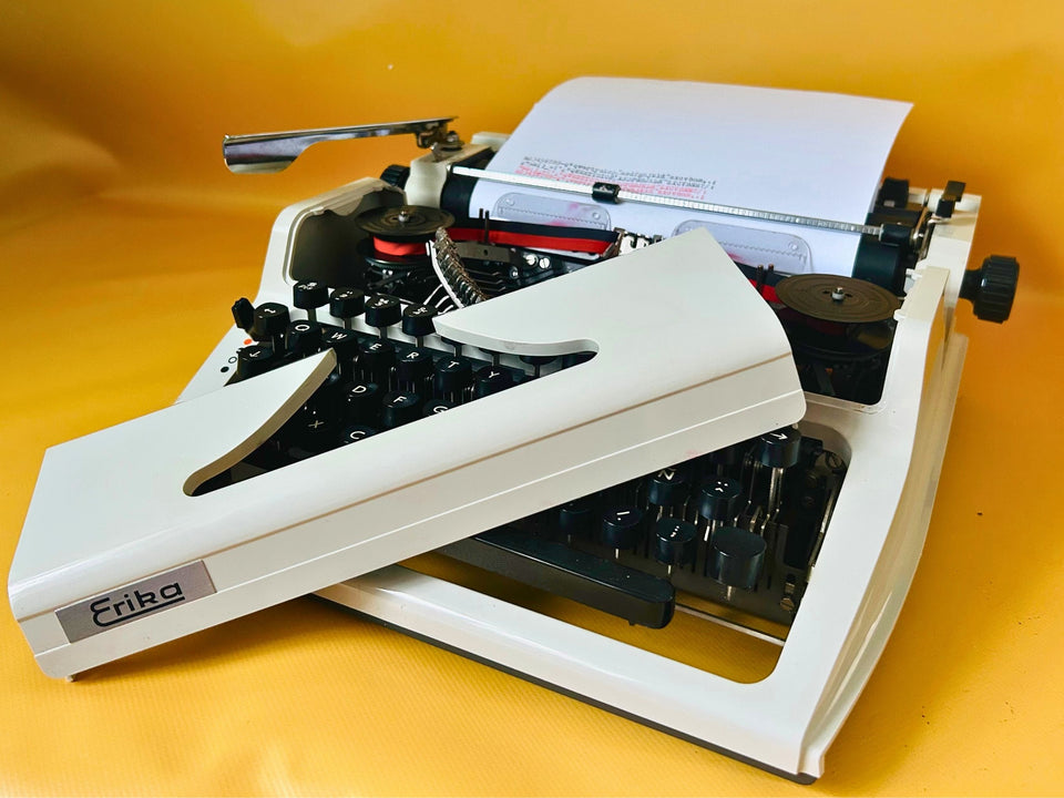 Erika Mod. 100 Typewriter | Spanish QWERTY Portable Manual Typewriter | Black Leather Case | Made in GDR