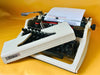 Erika Mod. 100 Typewriter | Spanish QWERTY Portable Manual Typewriter | Black Leather Case | Made in GDR
