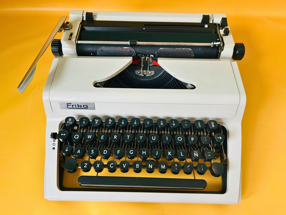 Vintage Erika Mod 100 manual typewriter made in GDR with black keys and black leather case
