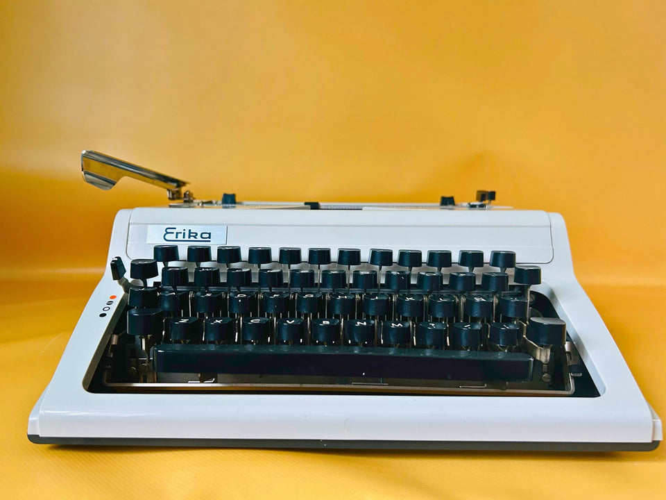 Erika Mod. 100 Typewriter | Spanish QWERTY Portable Manual Typewriter | Black Leather Case | Made in GDR