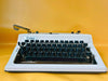Erika Mod. 100 Typewriter | Spanish QWERTY Portable Manual Typewriter | Black Leather Case | Made in GDR