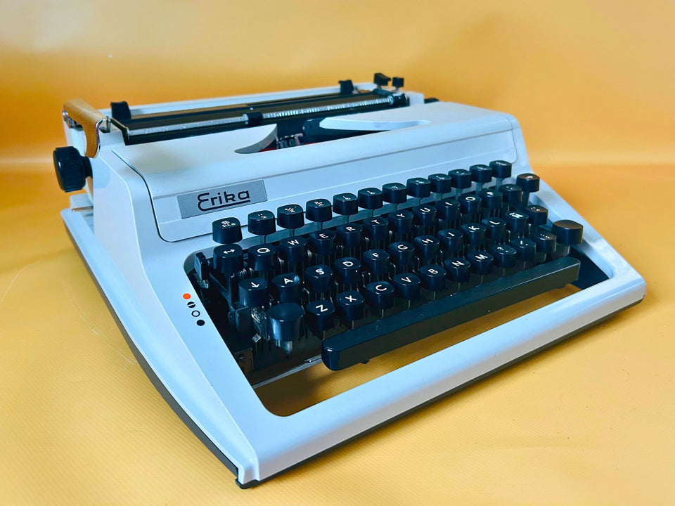 Erika Mod. 100 Typewriter | Spanish QWERTY Portable Manual Typewriter | Black Leather Case | Made in GDR