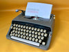 Working Brother Deluxe Typewriter | Blue Portable Manual Typewriter with Case | AZERTY