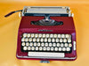 Working Maritsa 22 manual typewriter typing in black and red with matching red carrying case