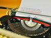 Vintage Maritsa 22 portable typewriter in burgundy red finish with Spanish keyboard layout