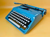 Remington Sperry Rand Ten Forty blue typewriter with English QWERTY keyboard