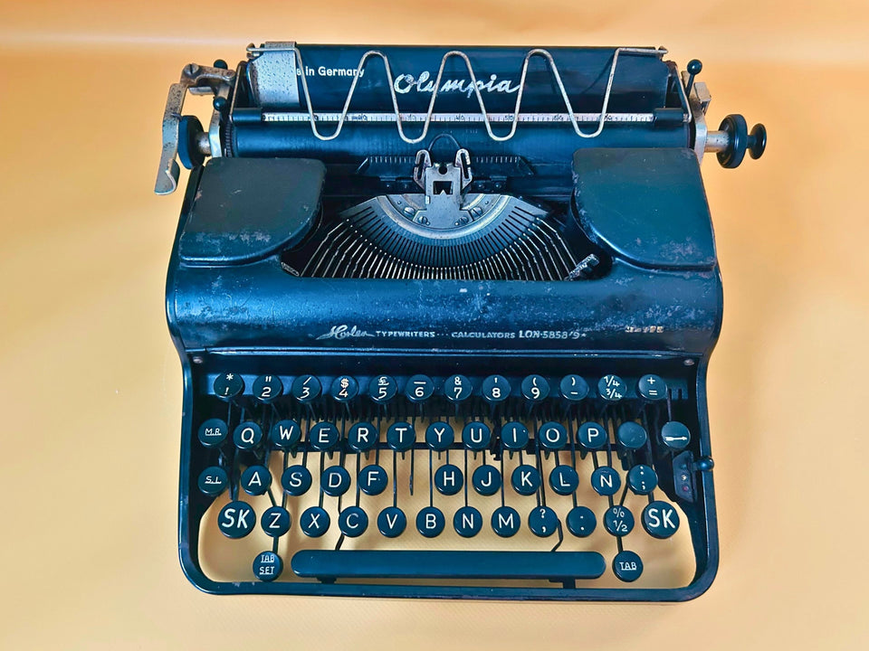 Rare Olympia Progress typewriter featuring Horler London retailer marking