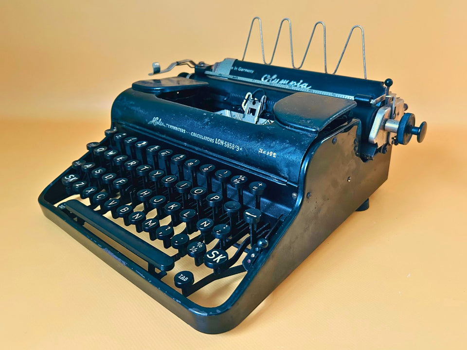 Olympia Progress portable typewriter from the 1930s with original carrying case