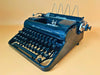 Olympia Progress portable typewriter from the 1930s with original carrying case