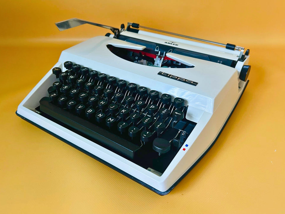 Adler Tippa white portable typewriter with English QWERTY keyboard and original case