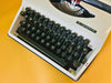 Adler Tippa portable typewriter close-up showing English QWERTY keyboard