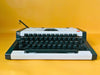 Olympia Traveller de Luxe Portable Typewriter – White & Black | QWERTZ | With Case | Professionally Serviced