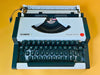 Vintage Olympia Traveller de Luxe white and black typewriter professionally serviced