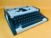 Olympia Traveller de Luxe Portable Typewriter – White & Black | QWERTZ | With Case | Professionally Serviced