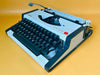 Olympia Traveller de Luxe portable typewriter with German QWERTZ keyboard and case
