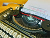 Close-up of the German QWERTZ keyboard on an Olympia Traveller de Luxe vintage typewriter showing original keys and excellent condition