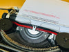 Typing sample produced by the Olympia Traveller de Luxe demonstrating clean black and red Cyrillic text with excellent print quality.