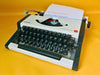 Olympia Traveller de Luxe vintage manual typewriter with rare Cyrillic keyboard, professionally serviced and fully working.