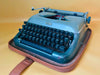 Erika 10 vintage manual typewriter with French AZERTY keyboard in metallic green, professionally serviced and fully working.