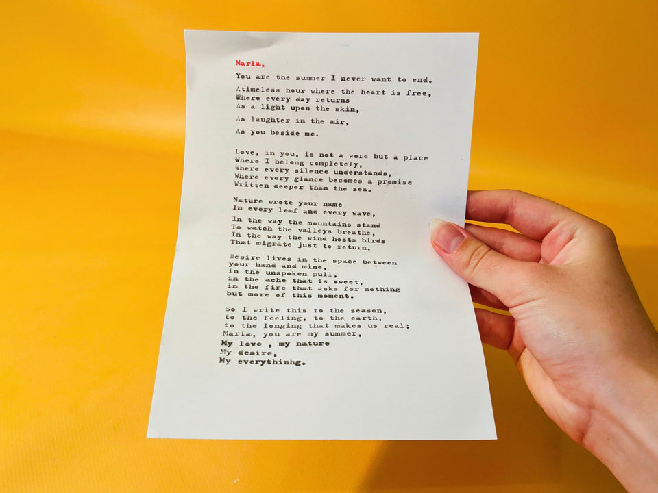 Custom typed poem on paper held in hand, black and red ink