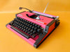 Custom pink Olympia Traveller De Luxe typewriter front view