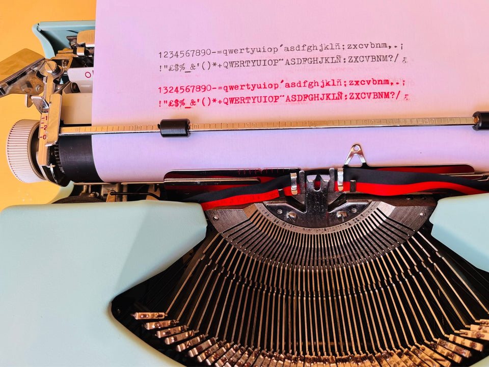 Working typewriter Nakajima All cyan blue writing sample close up