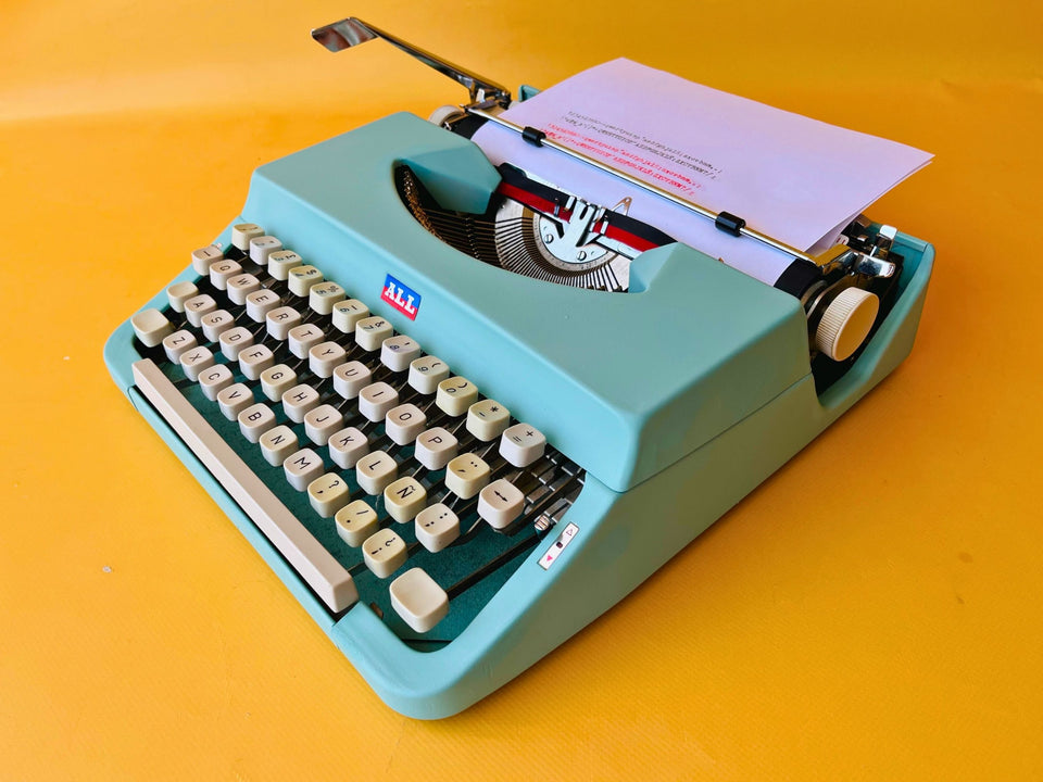 Working typewriter Nakajima All Model 2000 custom cyan blue front view