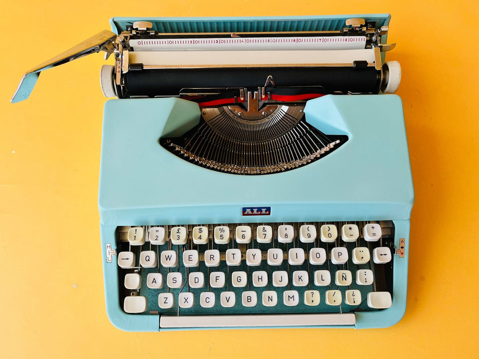 Working typewriter Nakajima All cyan blue top-down keyboard view