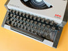 Working Olympia Traveller Deluxe Typewriter English QWERTY| White & Black | 1970s