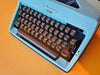 Olympia Monica | 1969 West German Icon | SM8 Working Typewriter Custom Cyan With Case