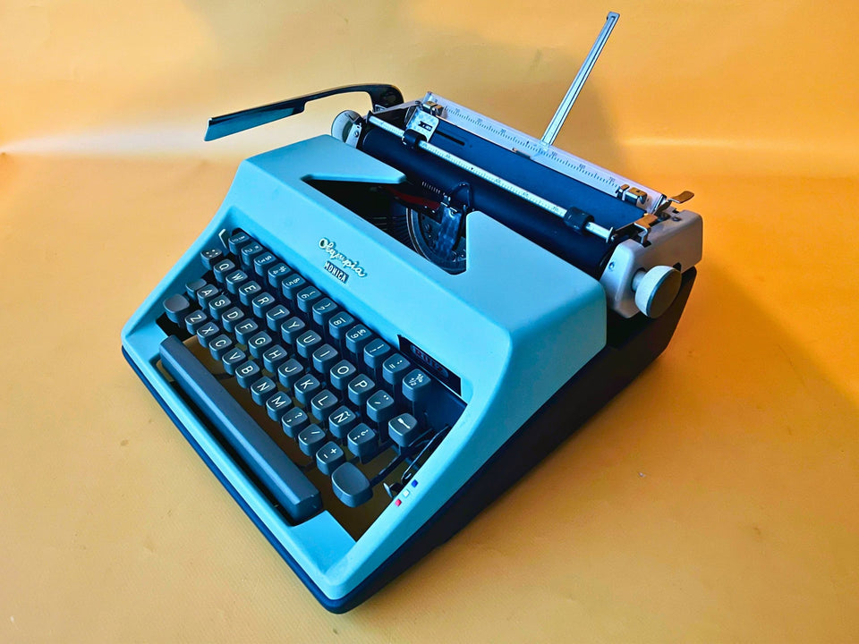 Working typewriter Olympia Monica custom cyan lid, main view with case