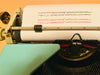 Olympia Monica typesample sheet typed in black and red