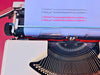 Triumph Tessy typesample sheet typed in black and red