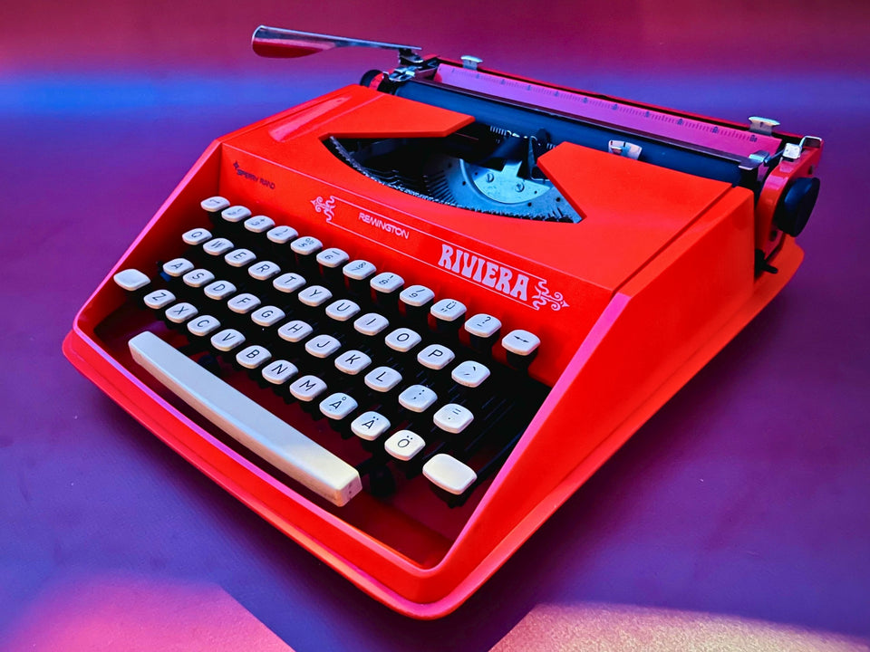 Orange Remington Riviera typewriter with Swedish Finnish QWERTY keyboard, top view