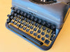 Remington Rand Deluxe Model 5 side view with Self Start key and ribbon color changer