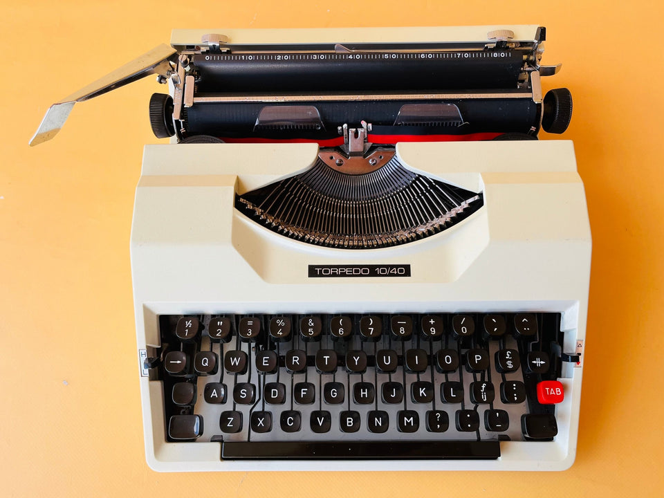 Torpedo 10/40 typewriter with matching white carrying case and black handle