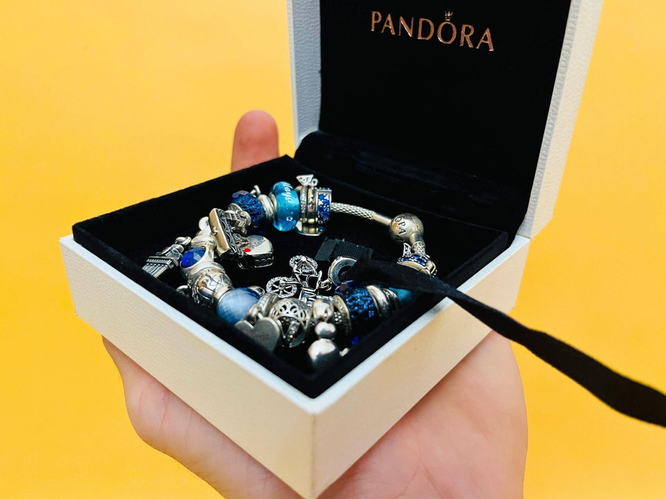Pandora silver charm bracelet worn on wrist jewelry display