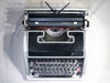 Close-up of the professional Spanish QWERTY keyboard on an Olivetti Lettera DL showing the Ñ key and sleek round keys.