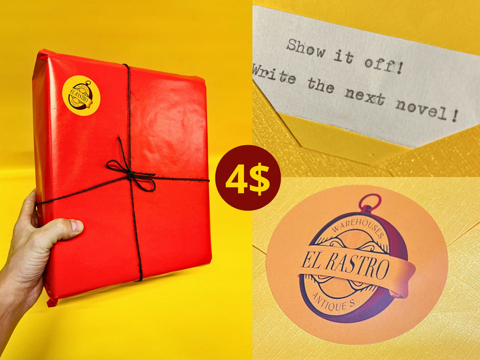 Red gift wrap tied with black twine and El Rastro Antiques seal
