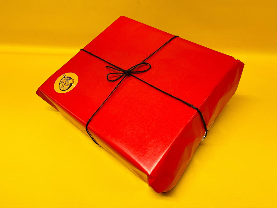 El Rastro Antiques branded round sticker seal on gift wrap