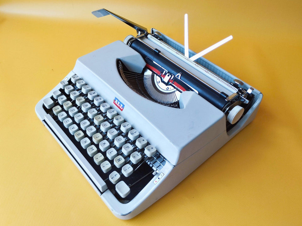 Nakajima white portable typewriter QWERTY