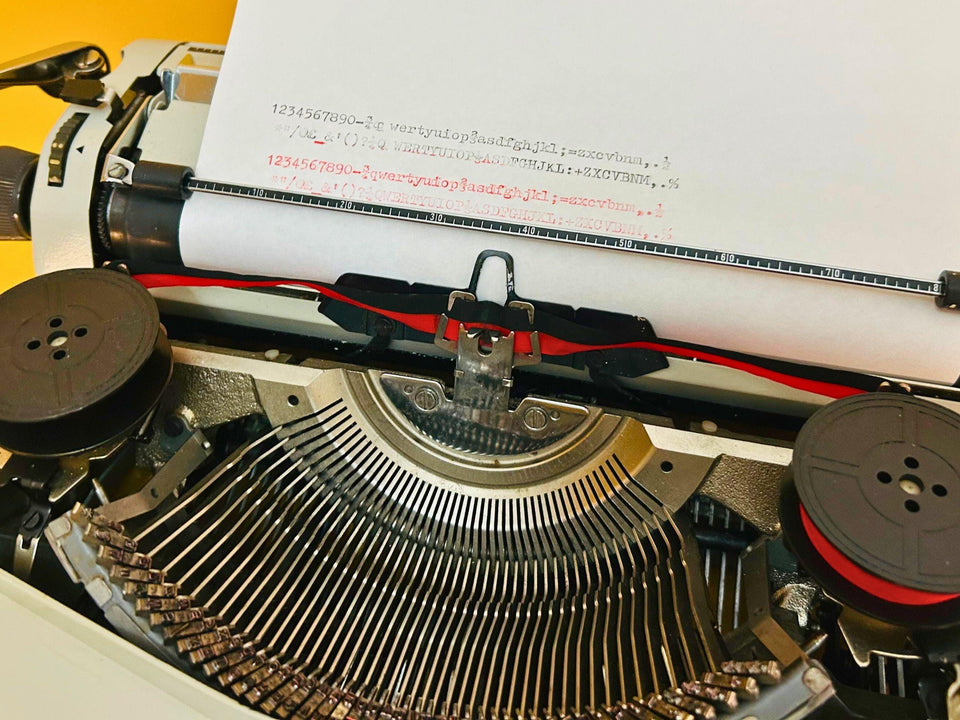 Adler Gabriele 25 typing sample typeface beige typewriter