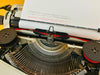 Adler Gabriele 25 typing sample typeface beige typewriter