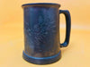 Pewter beer mugs detail engraved dragon design close-up